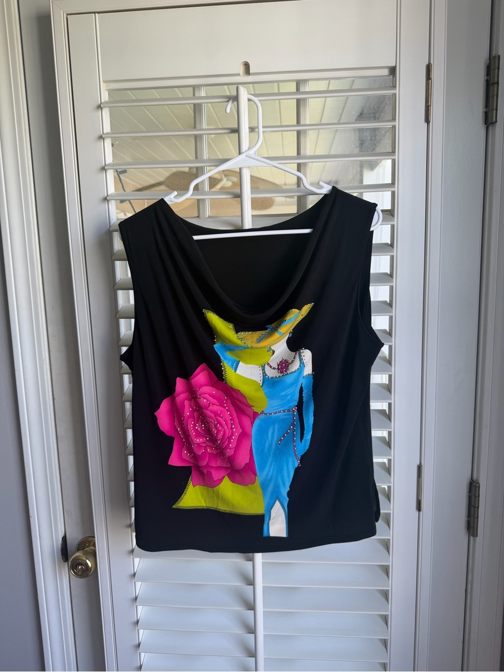 Y2K-era draped cowl neck top with 90s glamour fashion graphic